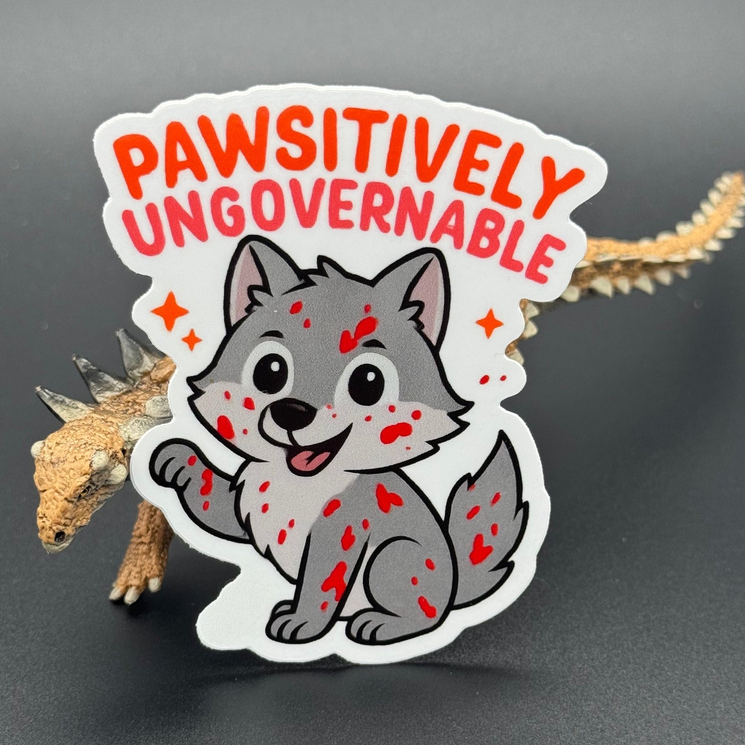 Sticker of a cute wolf covered in blood saying