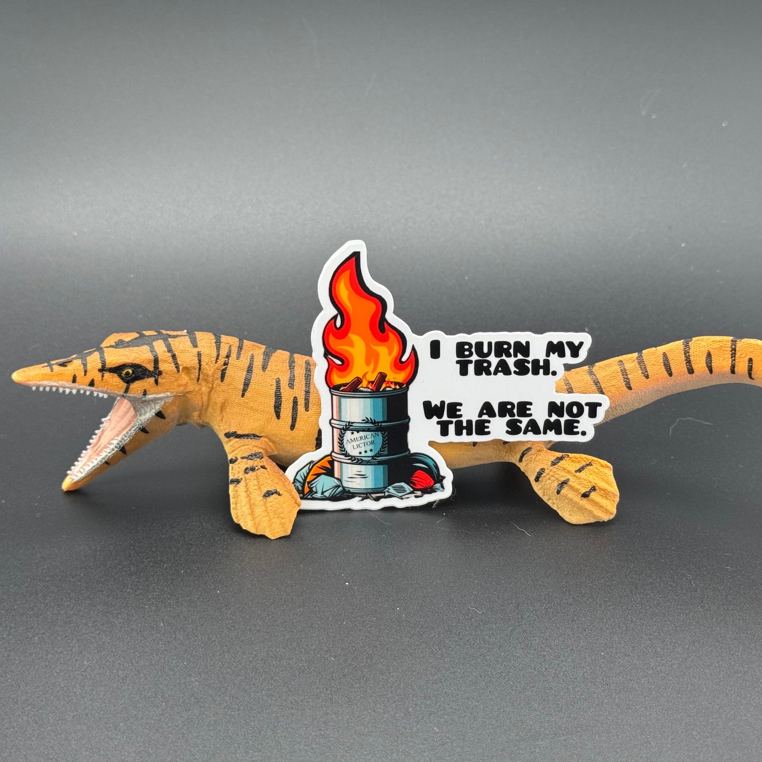 Sticker of an oil drum fire with the American Lictor Logo and the text