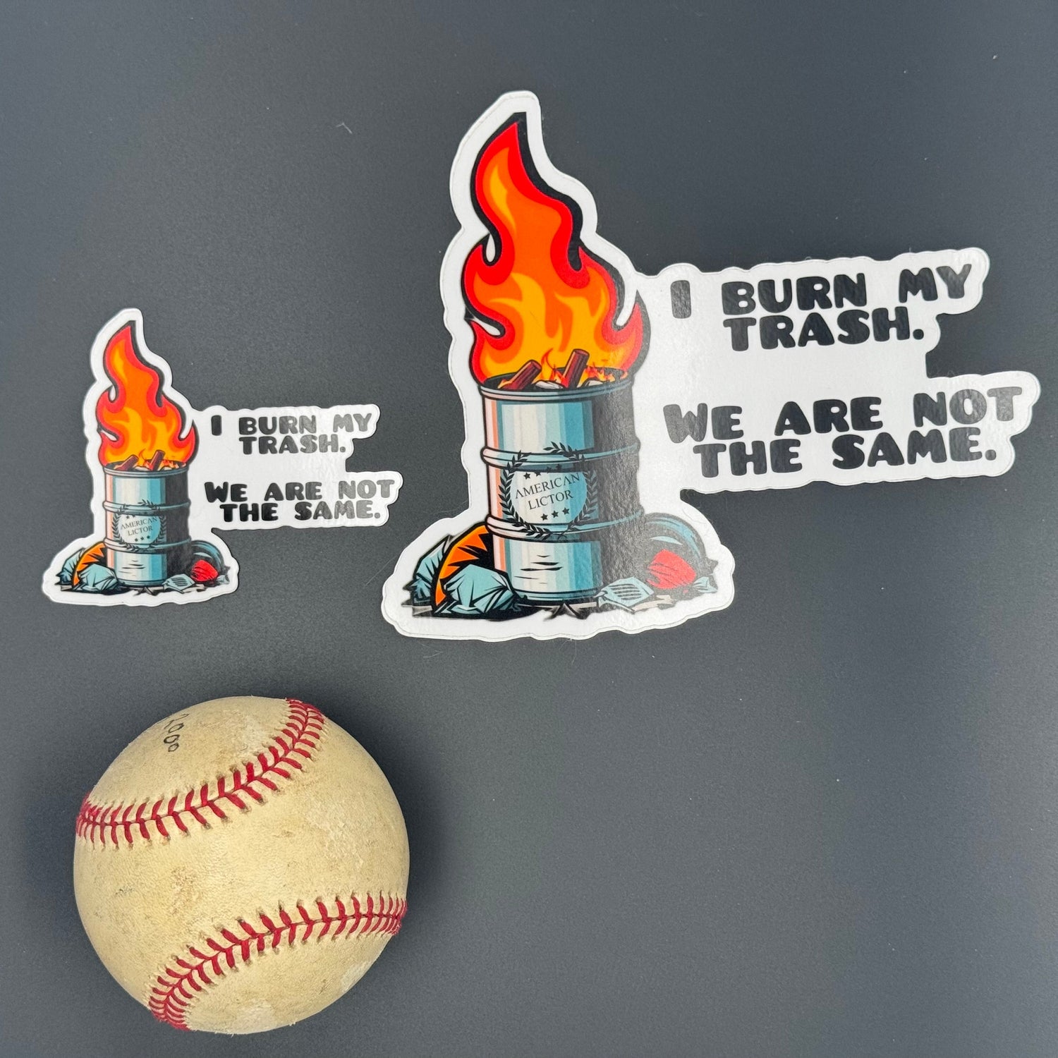 A small and large Sticker of an oil drum fire with the American Lictor Logo and the text