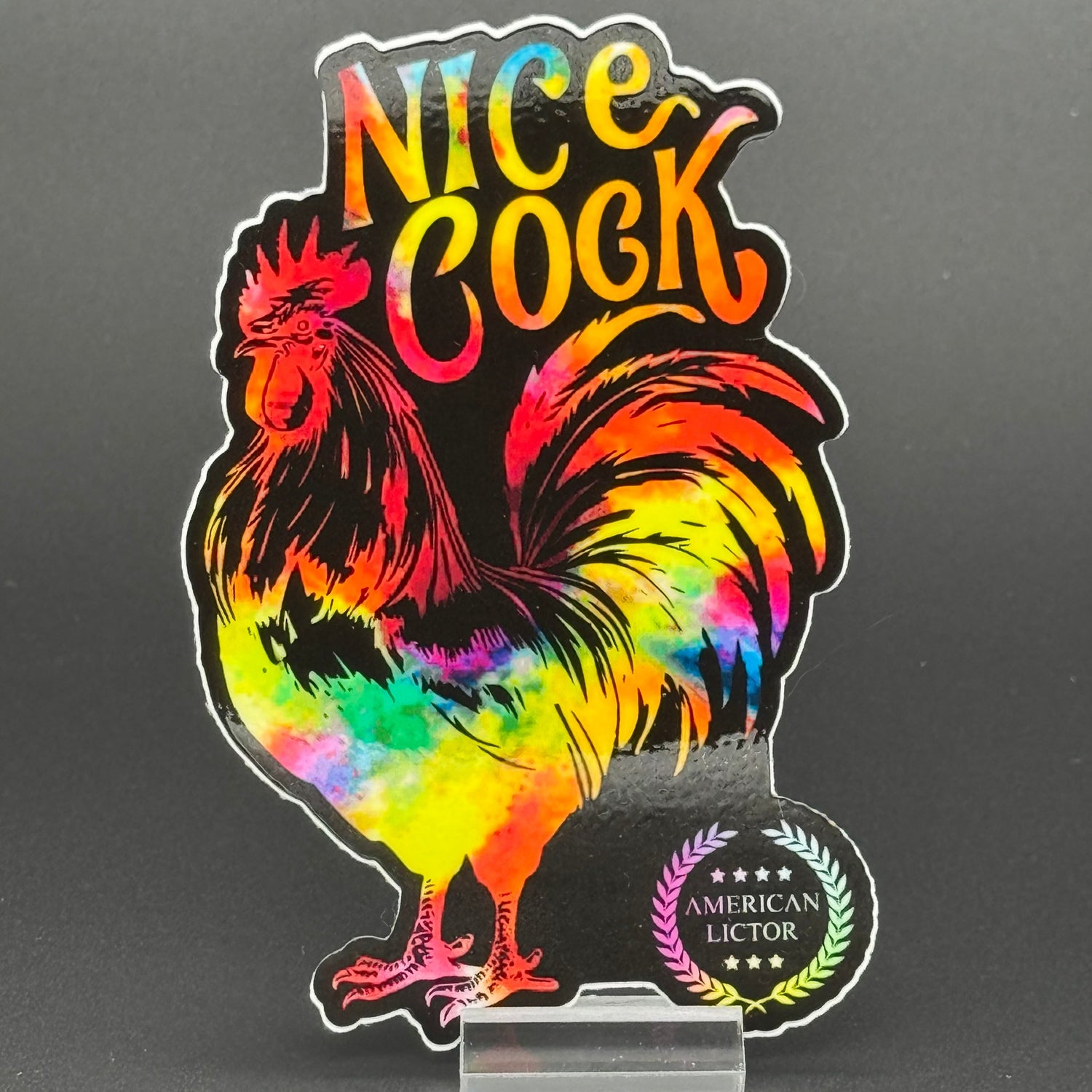 Sticker of a chromatic rooster on a black background with the text 'Nice Cock'