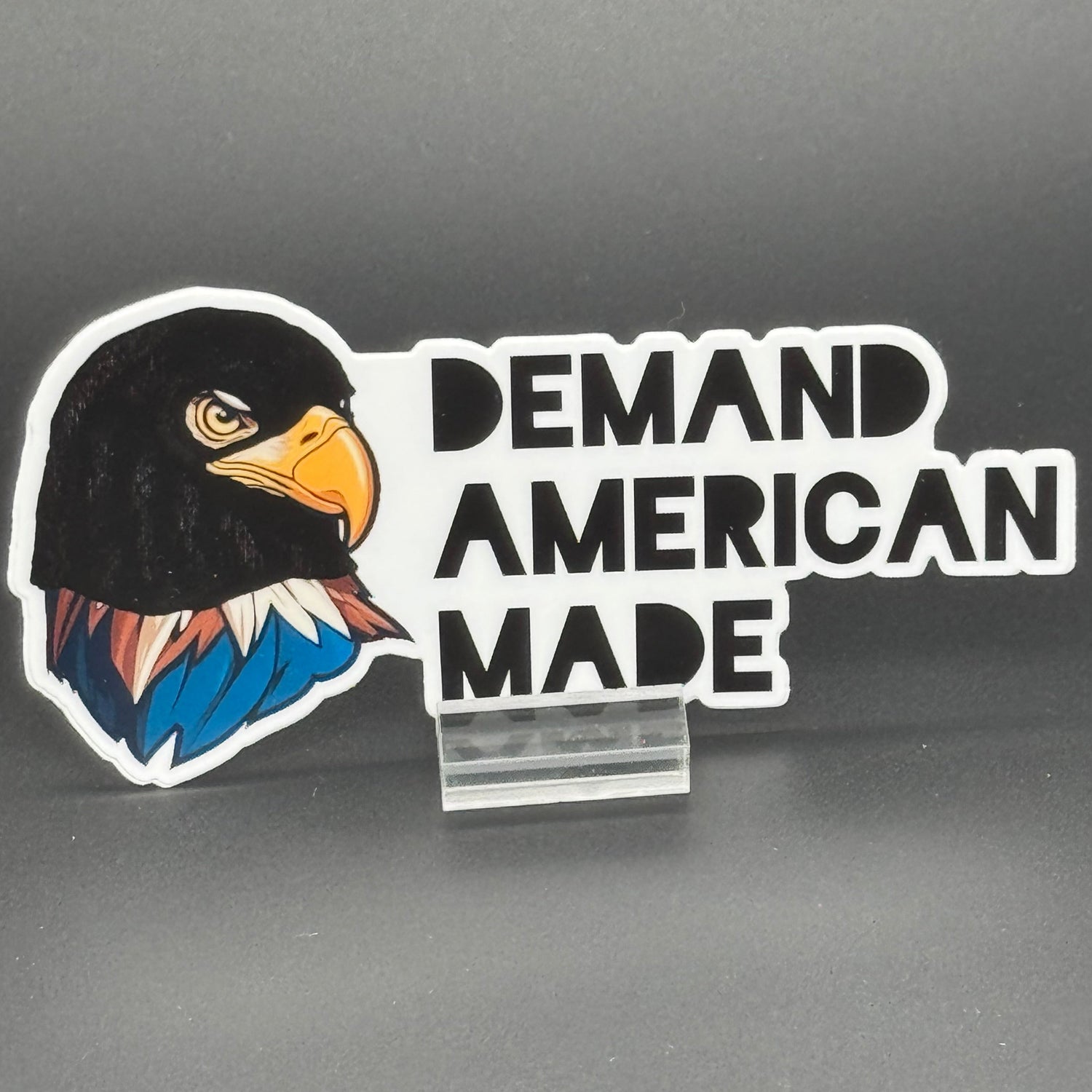 Sticker of an Eagle wearing a ski mask with the text 'Demand American Made'