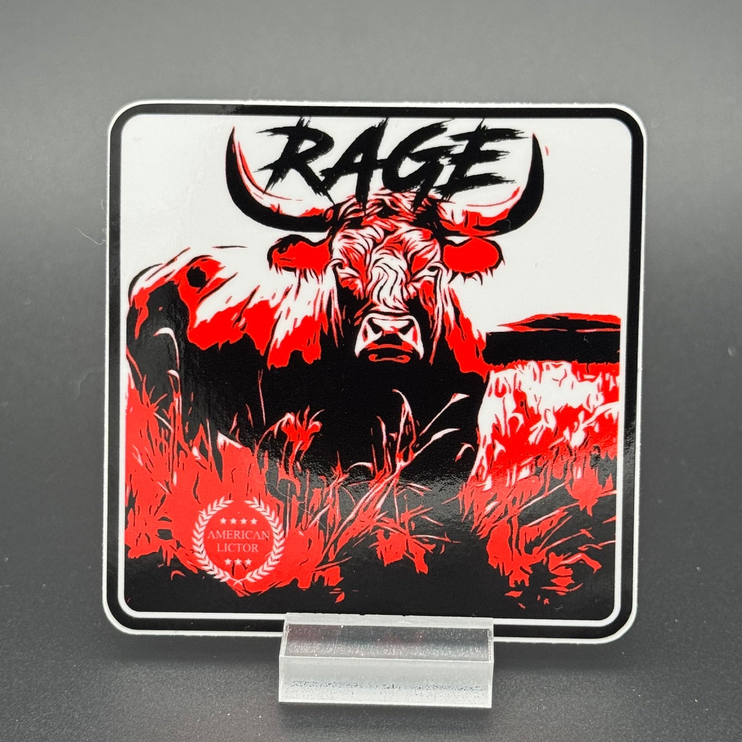 Black, red and white sticker of a bull with the text 'Rage'