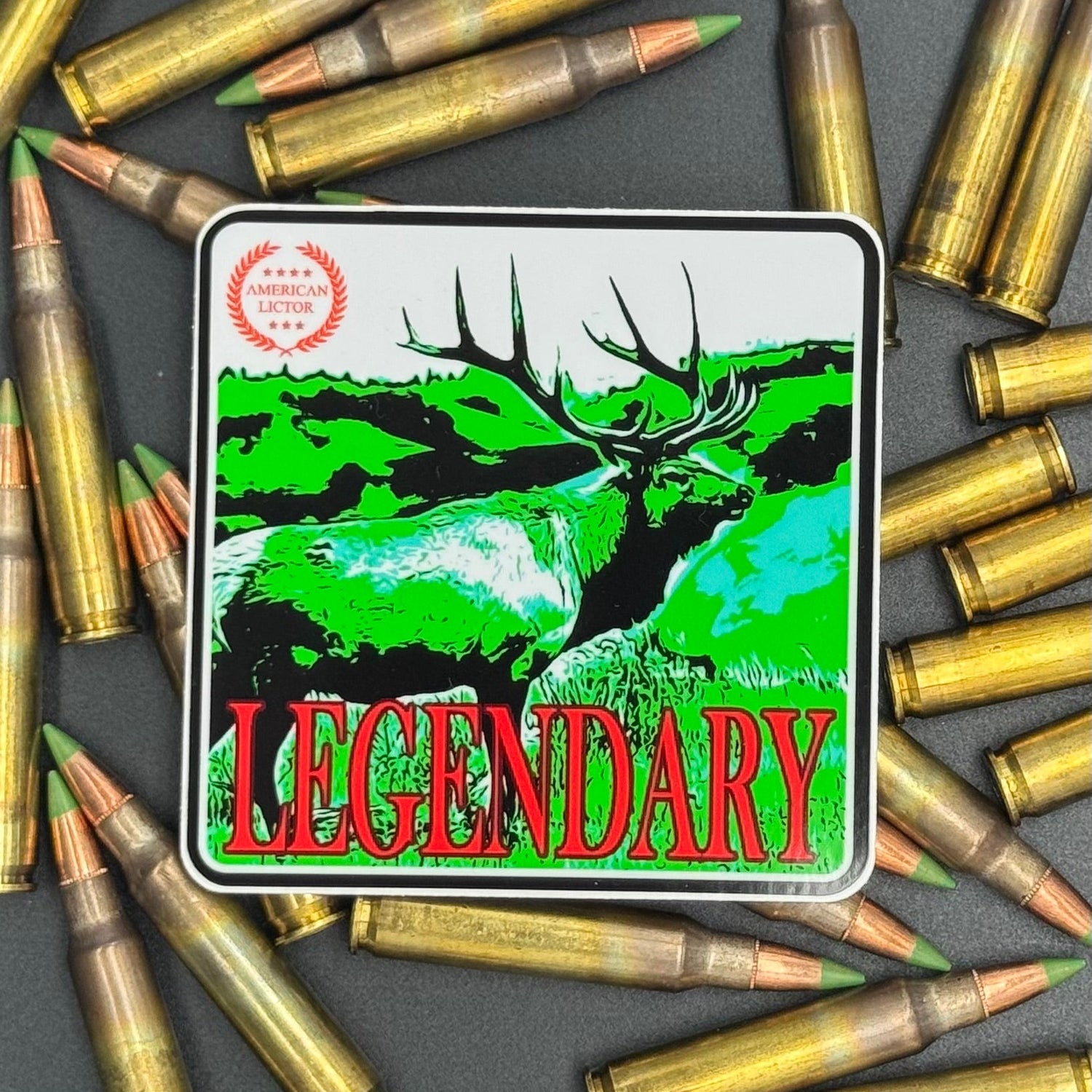 Green, red an White sticker of an elk with the text 'Legendary' on a bed of ammo
