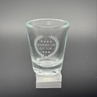 A Shot glass with the American Lictor Logo