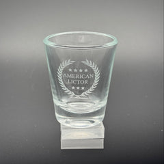 A Shot glass with the American Lictor Logo