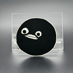 A leatherette patch of goofy cartoon character head wearing a ski mask