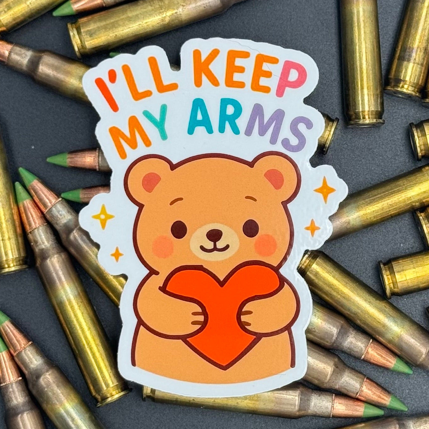 Sticker of a Brown Cartoon bear holding a heart saying 