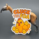 Sticker of a cute chicken with chicks saying "Cluck the FDA" posing with a prehistoric mammal