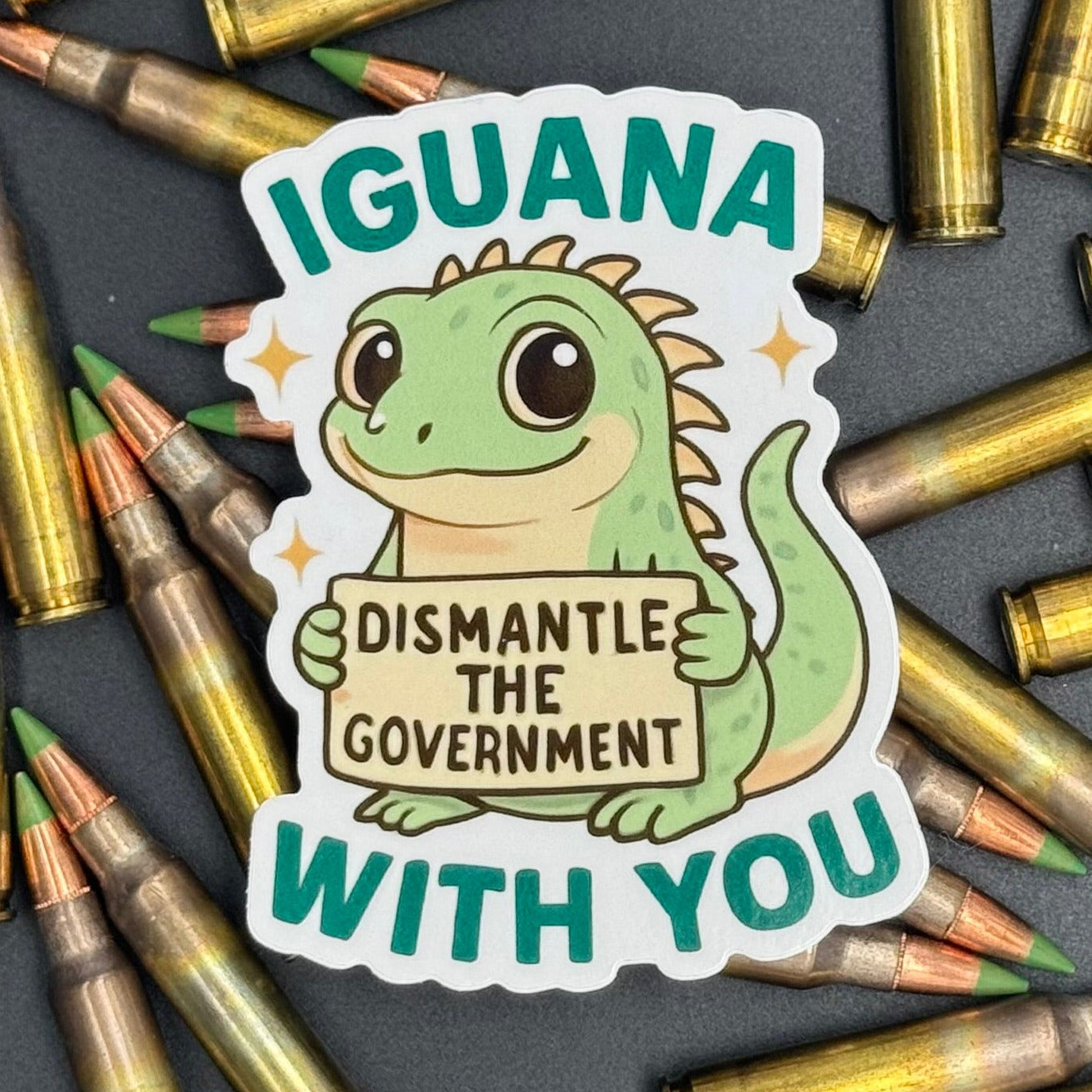 Sticker of a Green Cartoon Iguana holding a sign saying 