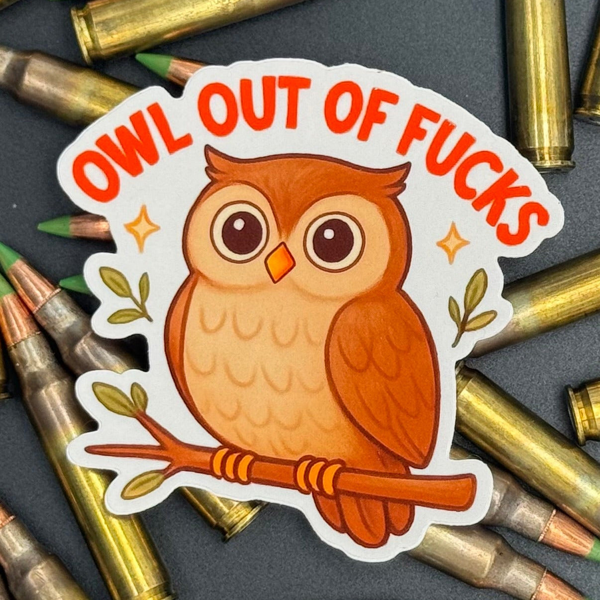 Sticker of a cute owl on a branch saying 