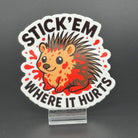 Sticker of a cute porcupine covered in blood saying "Stick 'em where it hurts"