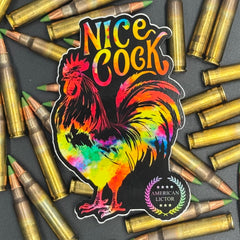 Sticker of a chromatic rooster on a black background with the text 'Nice Cock' on a bed of ammo
