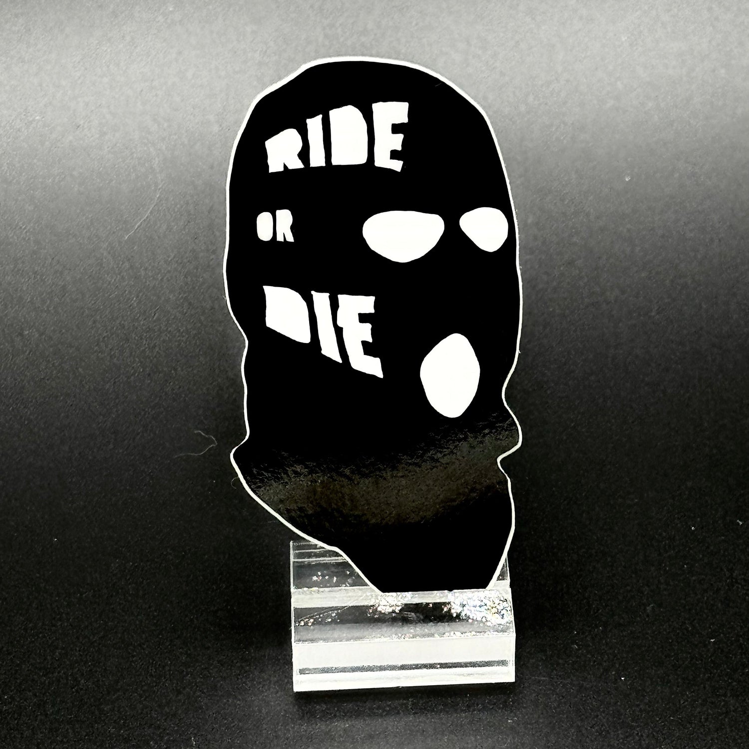 Sticker of a black ski mask with the text 'Ride or Die'