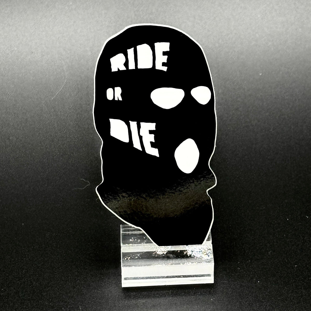 Sticker of a black ski mask with the text 'Ride or Die'