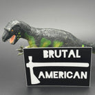 Black sticker with a tomahawk and the text 'Brutal American' posing with a dinosaur