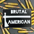 Black sticker with a tomahawk and the text 'Brutal American' on a bed of ammo