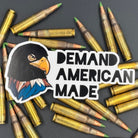 Sticker of an Eagle wearing a ski mask with the text 'Demand American Made' on a bed of ammo