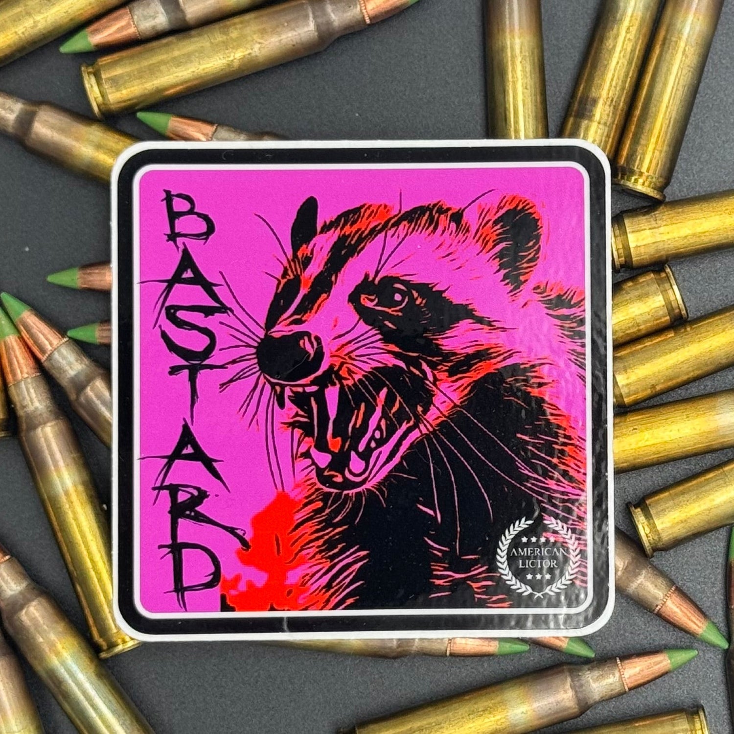 Black and Purple sticker of a badger with the text 'Bastard' on a bed of ammo