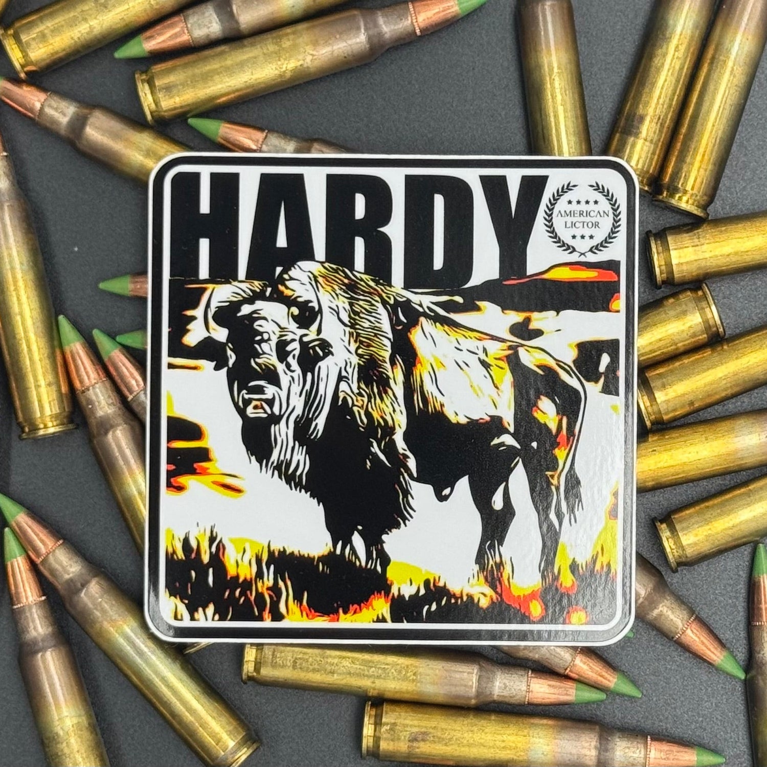 Black, yellow and white sticker of a Bison with the text 'Hardy' on a bed of ammo