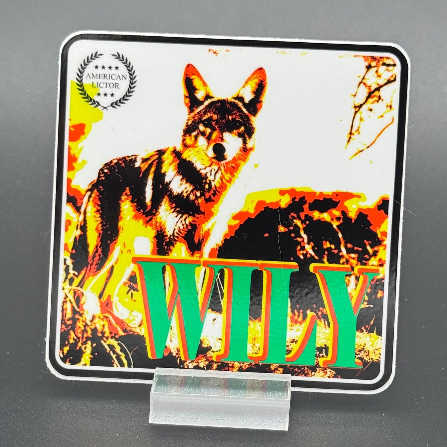 Multicolor sticker of a coyote with the text 'Wily'