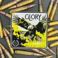 Black, yellow and white sticker of an eagle with the text 'Glory' on a bed of ammo
